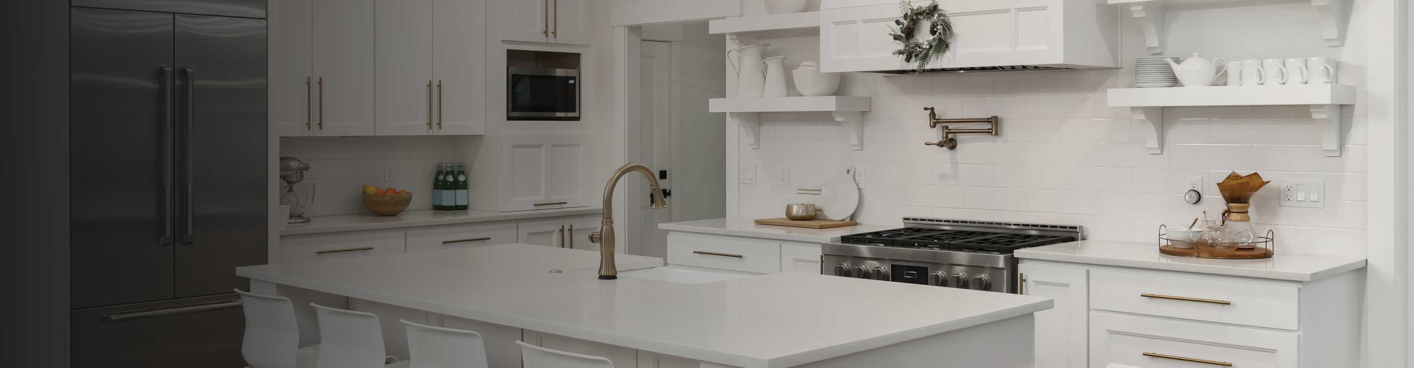 white tile backsplash in a kitchen with marble floors and white cabinets